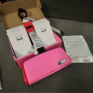 Pink mifold Grab-and-Go portable booster car seat.